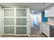 Kitchen pantry features sliding glass doors and stone countertops at 201 W Laurel St # 811, Tampa, FL 33602