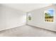 Bright bedroom with two windows and neutral carpet at 20387 Symphony Pl, Venice, FL 34293