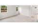 This bedroom has two windows and is carpeted at 20387 Symphony Pl, Venice, FL 34293