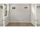 Cozy bedroom featuring light-colored walls, wood-style flooring, and natural light from the windows at 20405 Symphony Pl, Venice, FL 34293