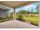Paver patio offers peaceful outdoor living, with views of the garden and landscaped backyard at 20405 Symphony Pl, Venice, FL 34293