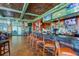 Spacious bar area with ample seating, multiple TVs, and well-stocked shelves with beer and liquor at 23717 Coral Ridge Ln, Land O Lakes, FL 34639