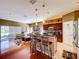 Open kitchen featuring a breakfast bar with seating, ample cabinets, and stainless steel appliances at 23717 Coral Ridge Ln, Land O Lakes, FL 34639