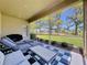 Relaxing screened lanai with comfortable seating and views of the lush green lawn at 23717 Coral Ridge Ln, Land O Lakes, FL 34639