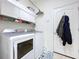 Convenient laundry room with washer, dryer, storage, and access to outdoors at 23717 Coral Ridge Ln, Land O Lakes, FL 34639