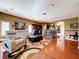 Spacious living room flowing into the kitchen with hardwood floors and modern decor at 23717 Coral Ridge Ln, Land O Lakes, FL 34639