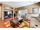 Cozy living room featuring built-in shelving, a large window, and modern decor at 23717 Coral Ridge Ln, Land O Lakes, FL 34639