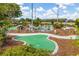 Scenic miniature golf course with a waterfall, lush greenery, and fun decorations at 23717 Coral Ridge Ln, Land O Lakes, FL 34639