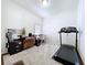 Well-lit office space with a treadmill, desk, and neutral carpet at 23717 Coral Ridge Ln, Land O Lakes, FL 34639