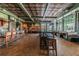 Spacious restaurant with wooden floors, a decorative ceiling, bar, tables, and booths at 23717 Coral Ridge Ln, Land O Lakes, FL 34639