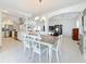 Bright and airy dining area with views into the modern kitchen and living room at 2593 W Vina Del Mar Blvd, St Pete Beach, FL 33706
