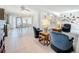 Bright, open floorplan connecting living, dining, and kitchen areas with tile floors at 2593 W Vina Del Mar Blvd, St Pete Beach, FL 33706