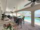 Entertaining patio includes a dining area, ceiling fans, and an outdoor sink and counter at 2593 W Vina Del Mar Blvd, St Pete Beach, FL 33706