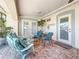 Covered patio seating area offers a relaxing outdoor space with bright furniture and accents at 2593 W Vina Del Mar Blvd, St Pete Beach, FL 33706