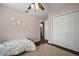 Well-lit bedroom featuring a closet and warm neutral paint at 2604 Manor Oak Dr, Valrico, FL 33596