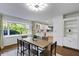 Dining room with parquet floors and a large bay window at 2889 Knollwood Ct, Clearwater, FL 33761