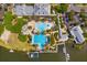 An aerial view showcasing the community's resort-style pool, clubhouse, and waterfront amenities at 319 Shore Crab Way, Apollo Beach, FL 33572