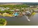 Aerial view of the community pool, boat docks, and surrounding green spaces at 319 Shore Crab Way, Apollo Beach, FL 33572