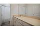 The clean bathroom features a single sink vanity and a separate toilet and shower area at 319 Shore Crab Way, Apollo Beach, FL 33572
