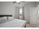 This bedroom features neutral walls, carpeted floors, and a window for natural light at 319 Shore Crab Way, Apollo Beach, FL 33572