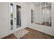 The foyer features wood-look flooring and a decorative mirror at 319 Shore Crab Way, Apollo Beach, FL 33572