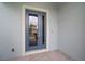 An inviting view of the front door with sleek design, offering a glimpse into a stylish home at 319 Shore Crab Way, Apollo Beach, FL 33572