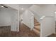 The hallway has hardwood floors and access to the staircase at 319 Shore Crab Way, Apollo Beach, FL 33572