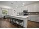 Spacious kitchen with a large island, stainless steel appliances, and dining area at 319 Shore Crab Way, Apollo Beach, FL 33572