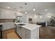 Bright and airy living space featuring a modern kitchen and open floor plan at 319 Shore Crab Way, Apollo Beach, FL 33572