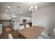 Open floor plan with a kitchen, dining area, and a cozy living room at 319 Shore Crab Way, Apollo Beach, FL 33572