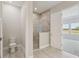 New bathroom with tiled shower and toilet at 35587 Stableton Ln, Zephyrhills, FL 33541