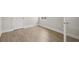 Bedroom featuring neutral luxury vinyl plank flooring and white trim at 35587 Stableton Ln, Zephyrhills, FL 33541