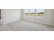 Bedroom with carpet and view from the windows at 35587 Stableton Ln, Zephyrhills, FL 33541