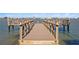 Community fishing dock with benches offers stunning views at 360 8Th N Ave # 3, Tierra Verde, FL 33715