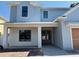 Charming two-story home with a welcoming facade and freshly installed double front doors at 3904 W Vasconia St, Tampa, FL 33629