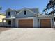 Beautiful two-story home featuring a paved driveway, and eye-catching architectural details at 3904 W Vasconia St, Tampa, FL 33629