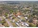 Overhead view of the property nestled in a neighborhood setting with trees and surrounding residences at 4020 Amber Rd, Valrico, FL 33594