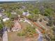 Aerial view of the property including the house, driveway, surrounding greenery, and a defined property line at 4020 Amber Rd, Valrico, FL 33594