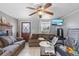 Cozy living room features tile flooring, fireplace, and comfortable seating at 4020 Amber Rd, Valrico, FL 33594
