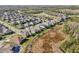 Wide aerial shot of residential properties bordered by lush greenery and peaceful wetlands at 4521 Tour Trce, Land O Lakes, FL 34638