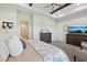 Elegant main bedroom featuring tray ceilings, a ceiling fan, and an en-suite bathroom at 4521 Tour Trce, Land O Lakes, FL 34638