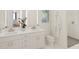Modern bathroom with dual sinks, vanity, and a luxurious glass-enclosed shower at 600 3Rd S Ave # 210, St Petersburg, FL 33701