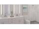Contemporary bathroom featuring a double sink vanity, stylish mirror, and walk-in shower at 600 3Rd S Ave # 210, St Petersburg, FL 33701