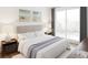 Cozy bedroom with a large window, neutral tones, and comfortable bedding, creating a relaxing atmosphere at 600 3Rd S Ave # 210, St Petersburg, FL 33701