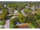 Overhead view of the neighborhood and houses with mature trees and landscaping at 9315 N 19Th St, Tampa, FL 33612