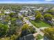 An aerial view that shows the neighborhood's layout and proximity to local amenities and roads in a sunny atmosphere at 9315 N 19Th St, Tampa, FL 33612