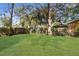 Expansive backyard offers lush greenery and ample space for outdoor activities at 9315 N 19Th St, Tampa, FL 33612