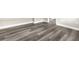 Gray, wood-look vinyl floors and base trim in a bright, neutral-walled space at 9315 N 19Th St, Tampa, FL 33612
