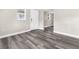 Neutral colored room with modern grey vinyl flooring and white door at 9315 N 19Th St, Tampa, FL 33612