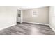 Bright room with modern grey vinyl flooring and neutral walls at 9315 N 19Th St, Tampa, FL 33612